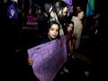Una niña lleva una pancarta durante una manifestación por el Día de la Mujer en A Coruña