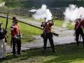 16 enero 2023. Los jardines de la Maestranza acogieron la representación de un combate con disparos de fogueo y una ofrenda floral en la recreación de la Batalla de Elviña