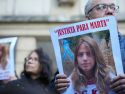 Manifestantes con carteles con la foto de Marta del Castillo, durante la concentración ante los juzgados por el 15 aniversario de su asesinato