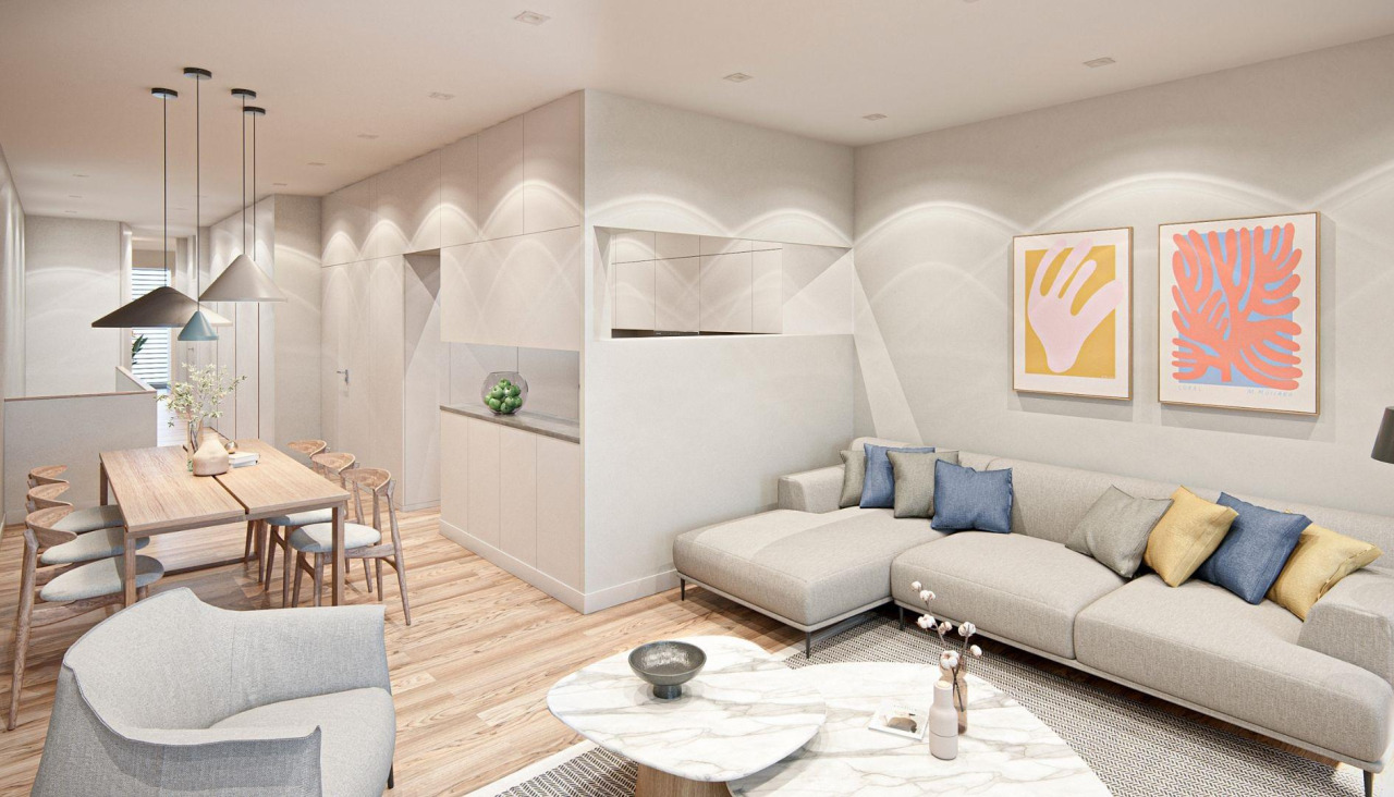 Cocina semiabierta, mesa de comedor y parte del salón de uno de los pisos de San Andrés